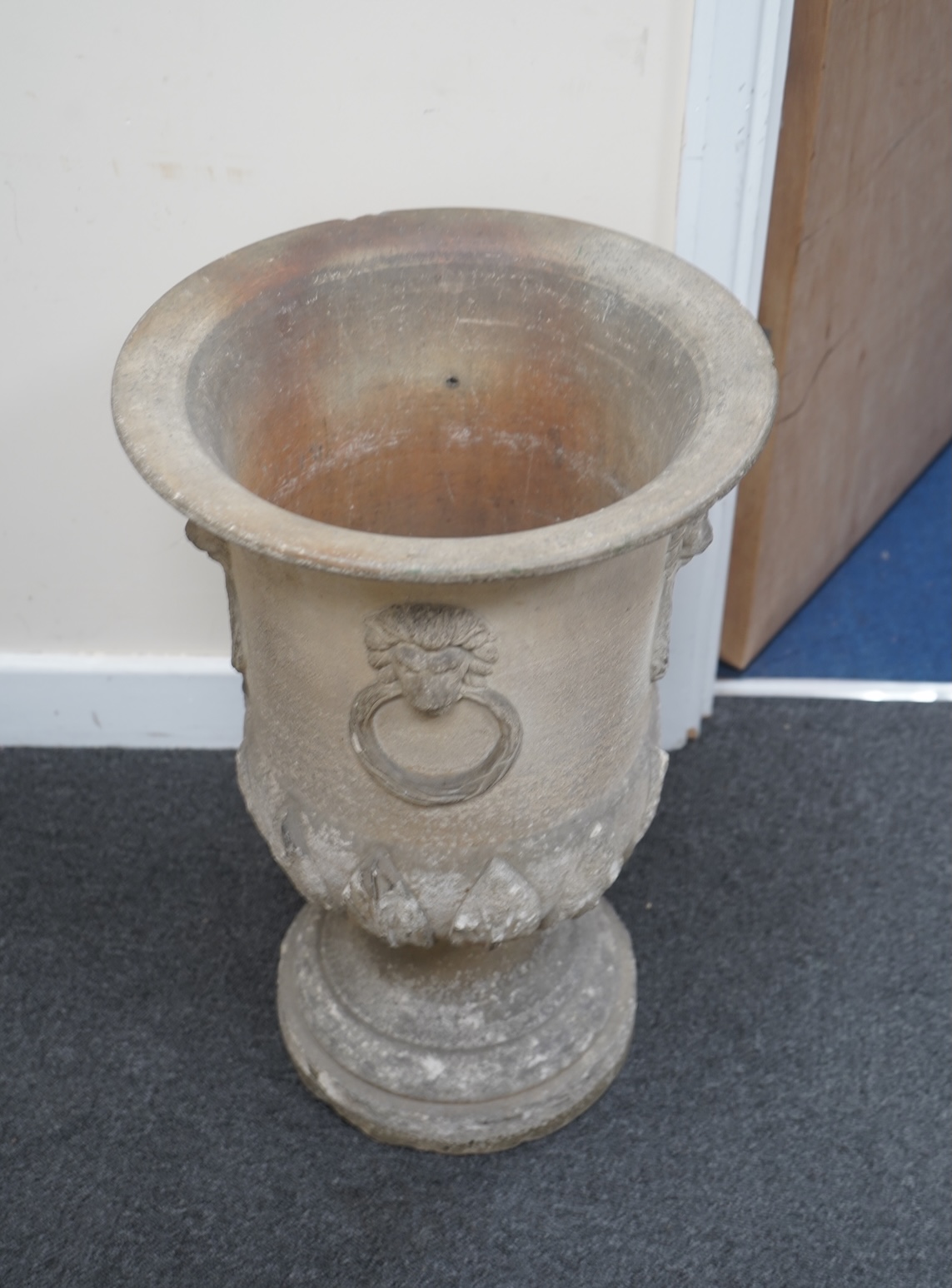 A 19th century circular earthenware urn